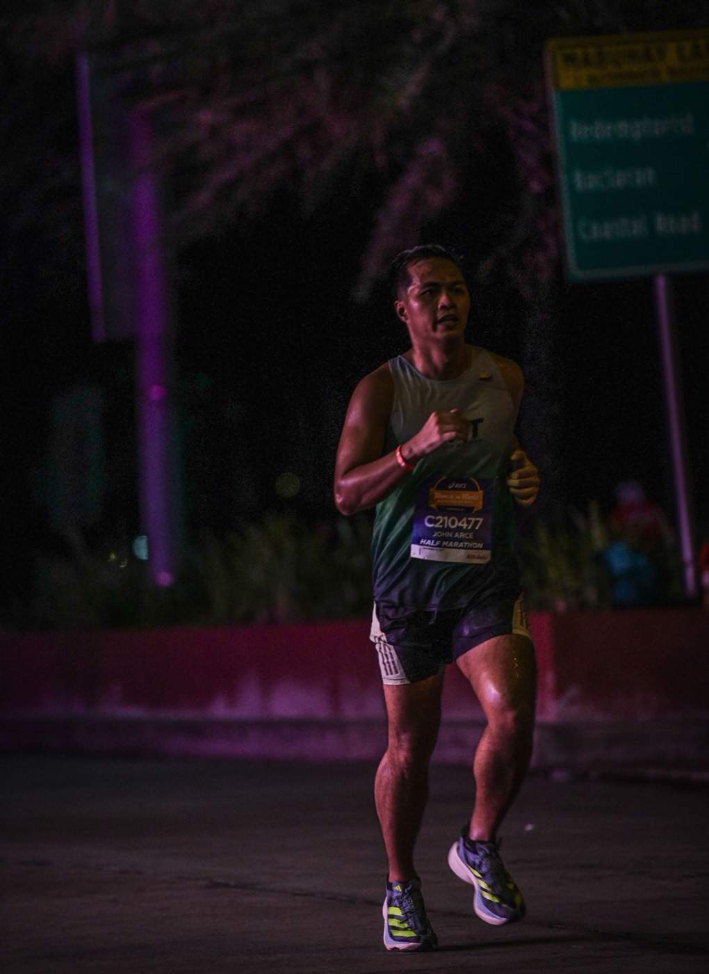 John Arce running a half marathon race at night